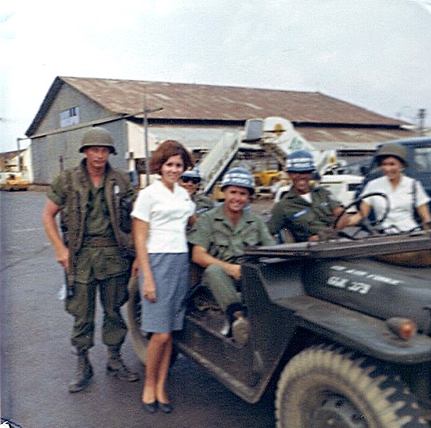 1960s Venice poses with Armed Service members during a transit of Saigon.  Her arcraft is about to depart with a load of soldiers heading for Rest & Recuperation away from Vietnam.  Pan Am flew hundreds of these flights during the Vietnam conflict.  They were operated at cost and not for profit..